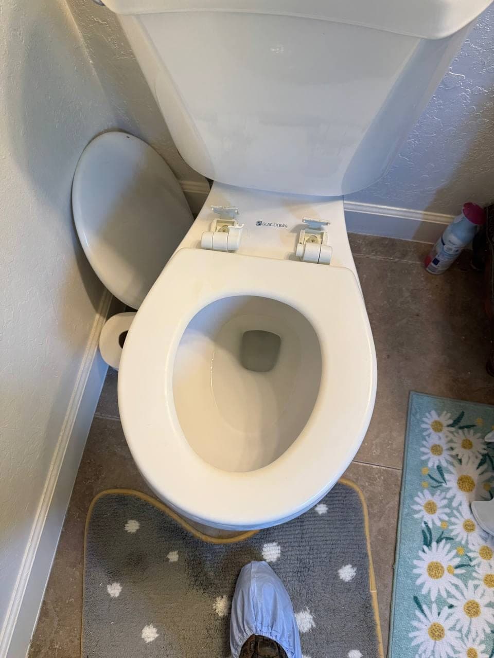 Toilet area inspected during an upstairs leak diagnosis